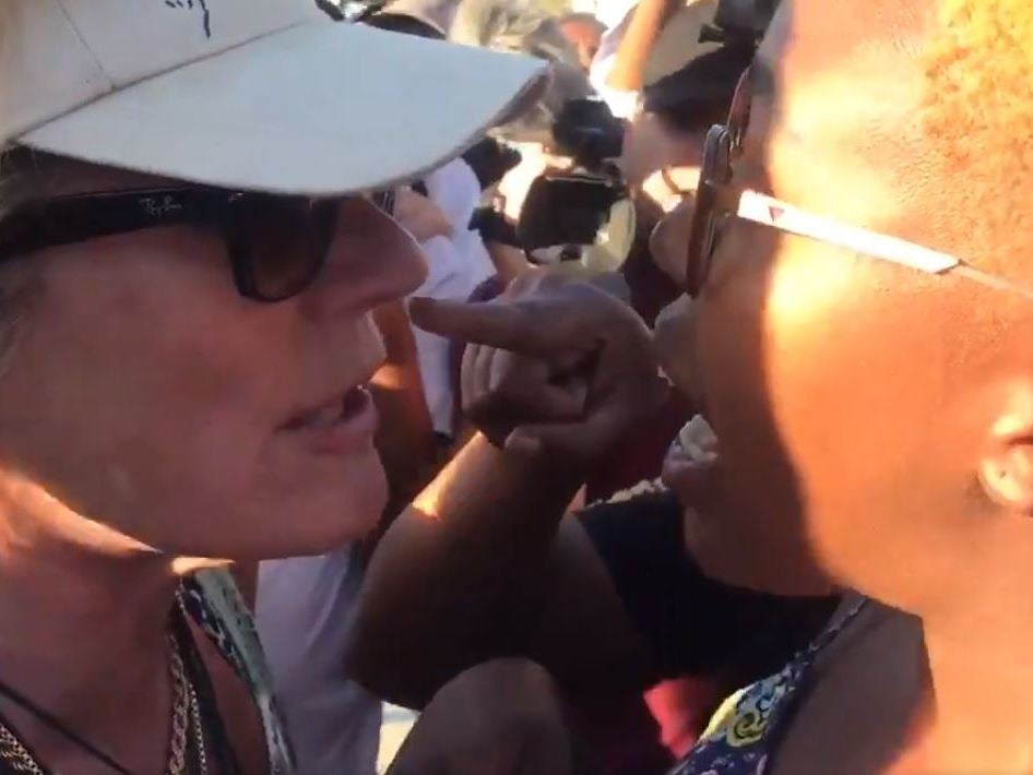 Furious rows erupted between black and white people at the beach over whether the security guards had been racist and about the slaughter of a sheep