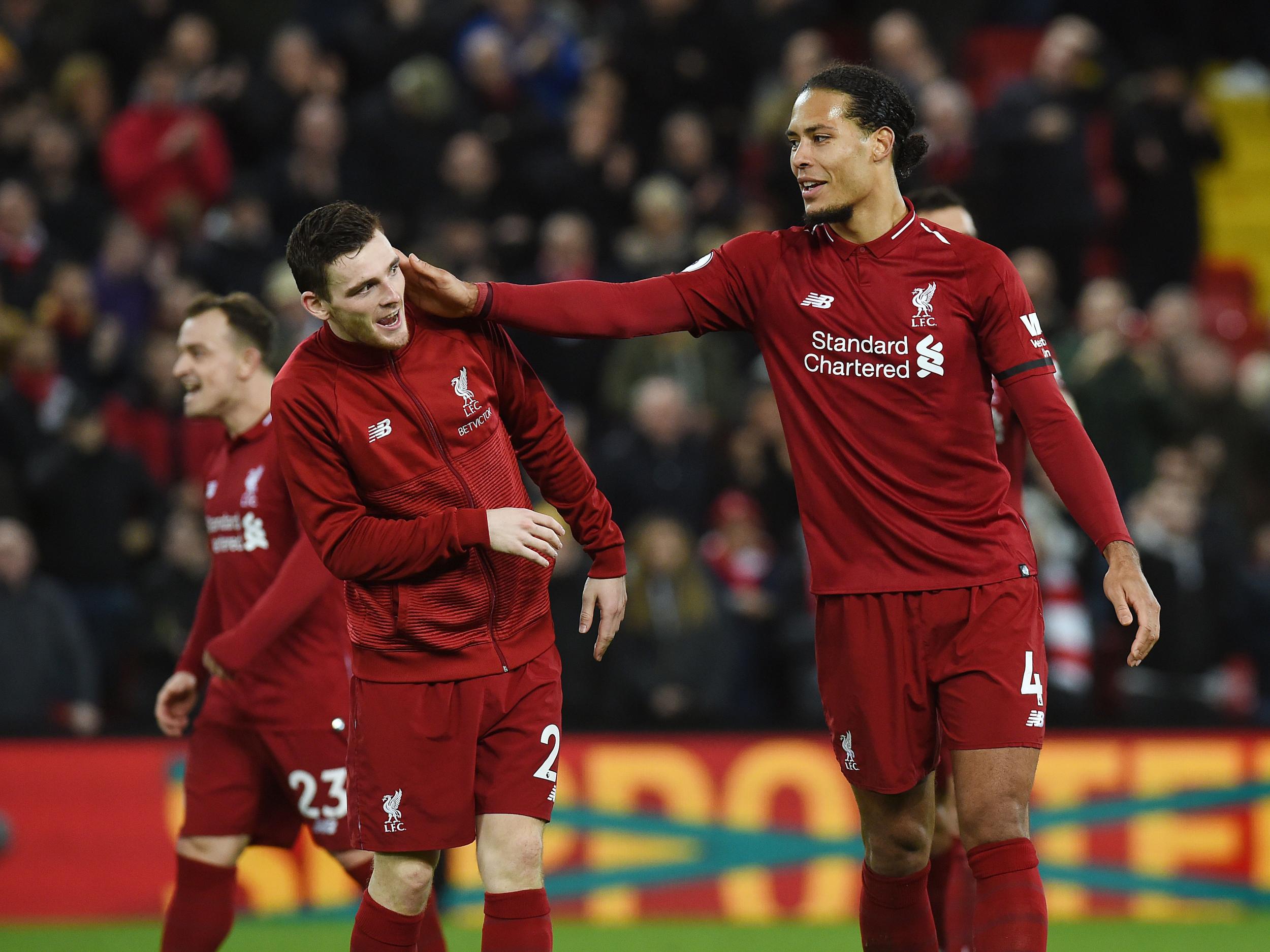 Virgil van Dijk celebrates Liverpool's win with Andy Robertson