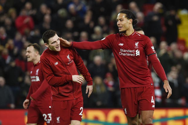 Virgil van Dijk celebrates Liverpool's win with Andy Robertson