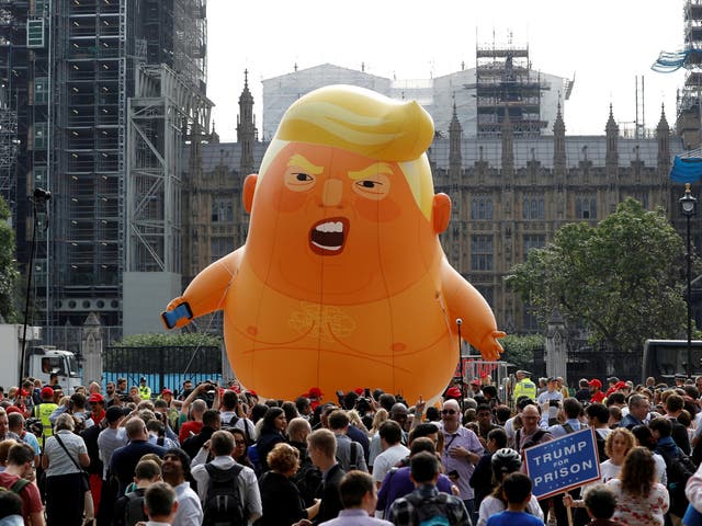 <p>The Baby Trump blimp, bright orange and full of hot air, made its debut in London in July 2018 </p>