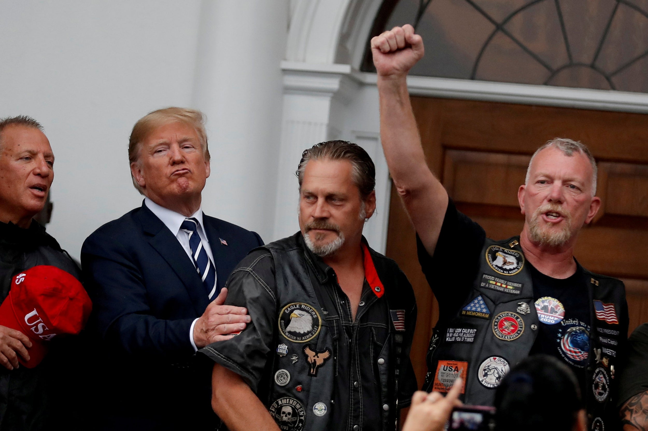 Reuters photographer Carlos Barria (Trump meets with supporters from a group called "Bikers for Trump" at the Trump National Golf Club in New Jersey)