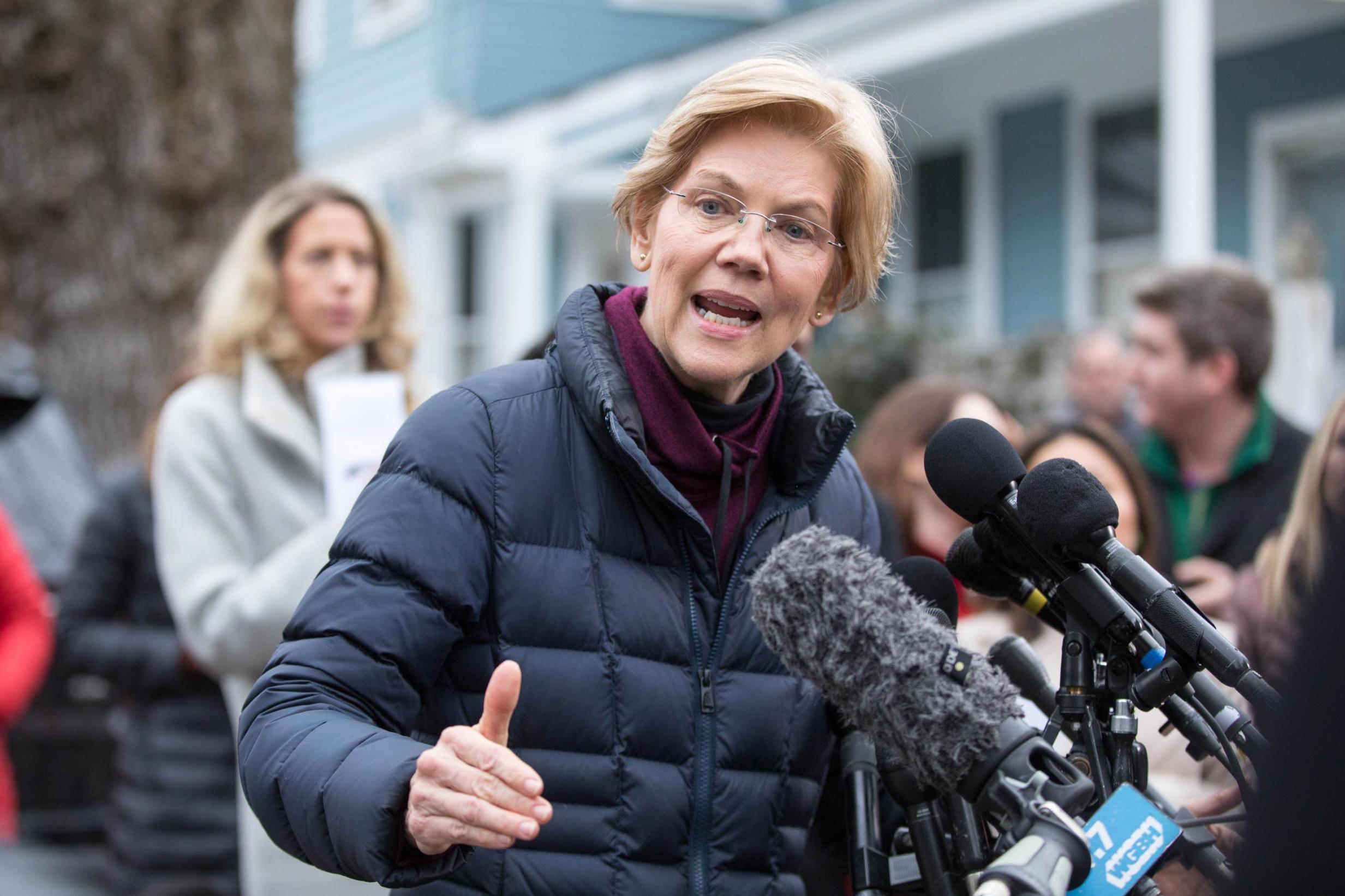 Senator Elizabeth Warren addresses the media outside of her home after announcing she formed an exploratory committee for a 2020 Presidential run on 31 December 2018 in Cambridge, Massachusetts