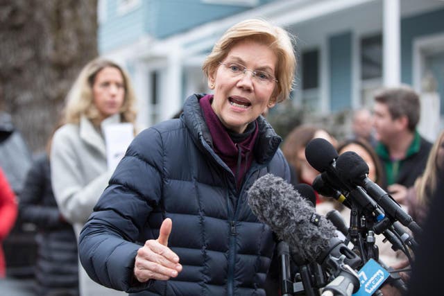 Senator Elizabeth Warren addresses the media outside of her home after announcing she formed an exploratory committee for a 2020 Presidential run on 31 December 2018 in Cambridge, Massachusetts
