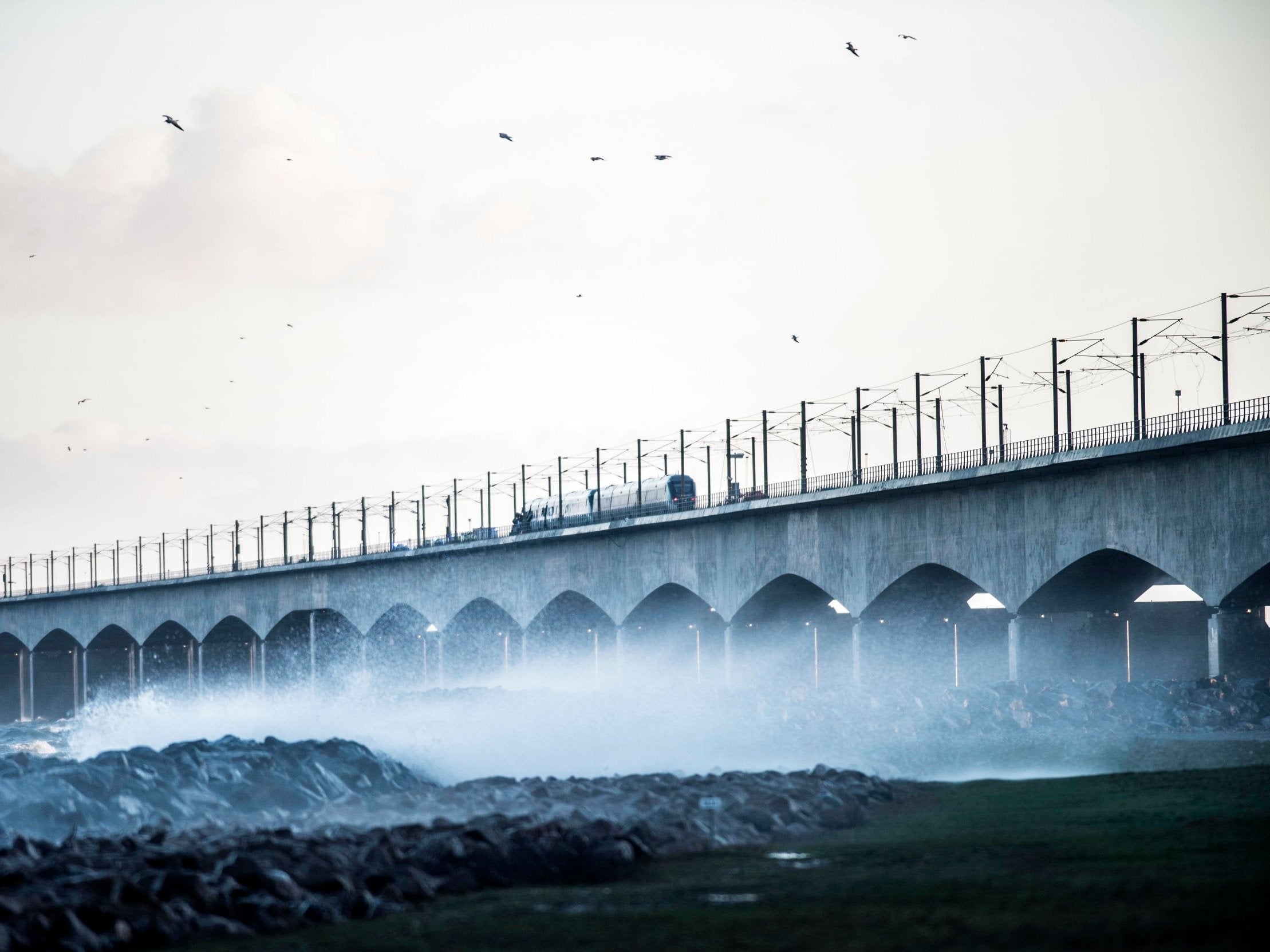 The bridge provides road and rail links between islands