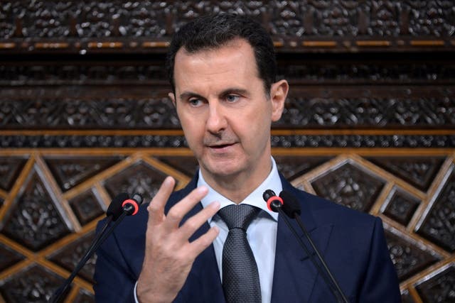 Syria's president Bashar al-Assad speaks to Parliament members in Damascus