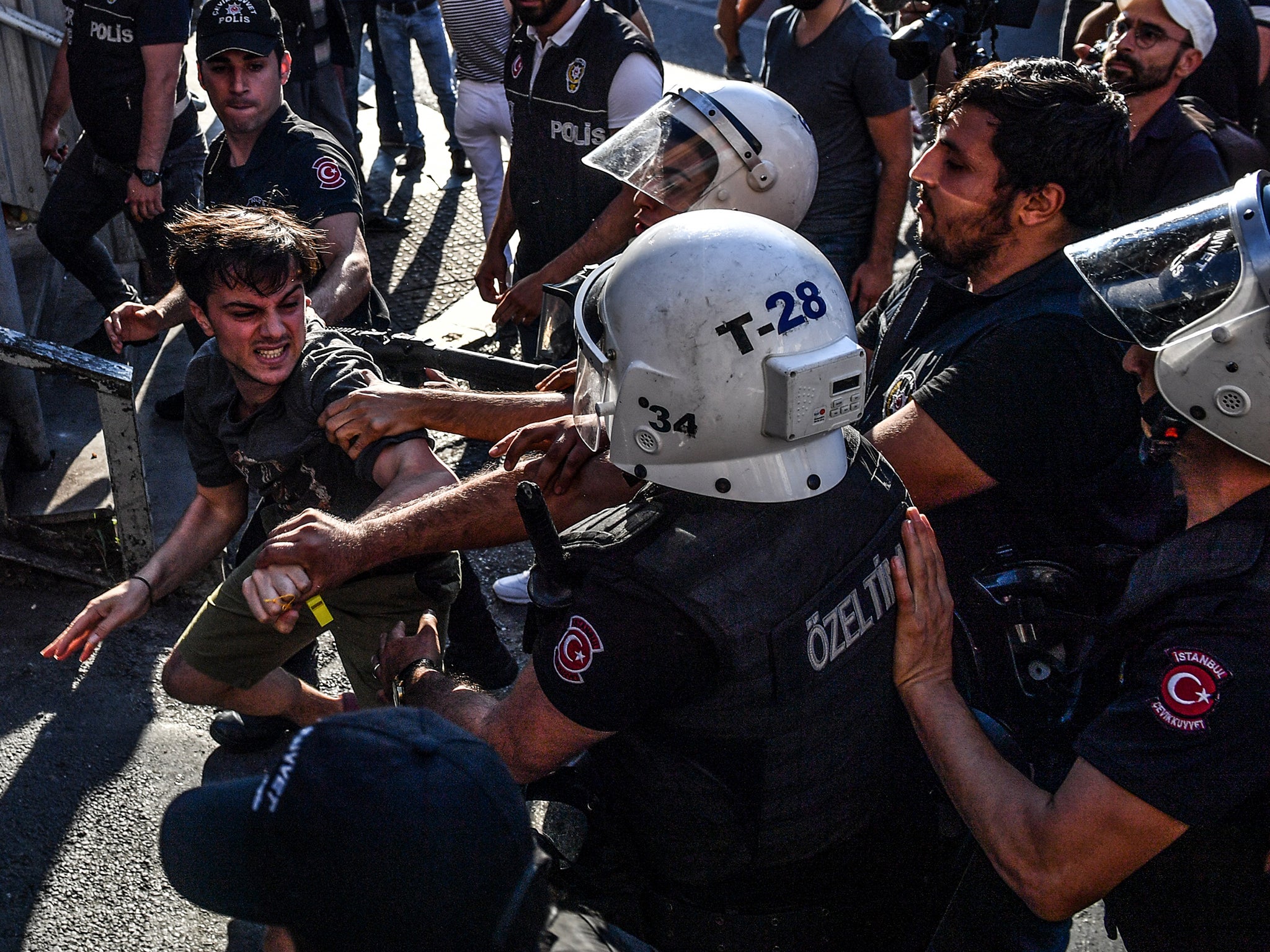 Riot police beat an LGBT+ rights activist after Turkish authorities banned last July’s event for a fourth year in a row (Getty)