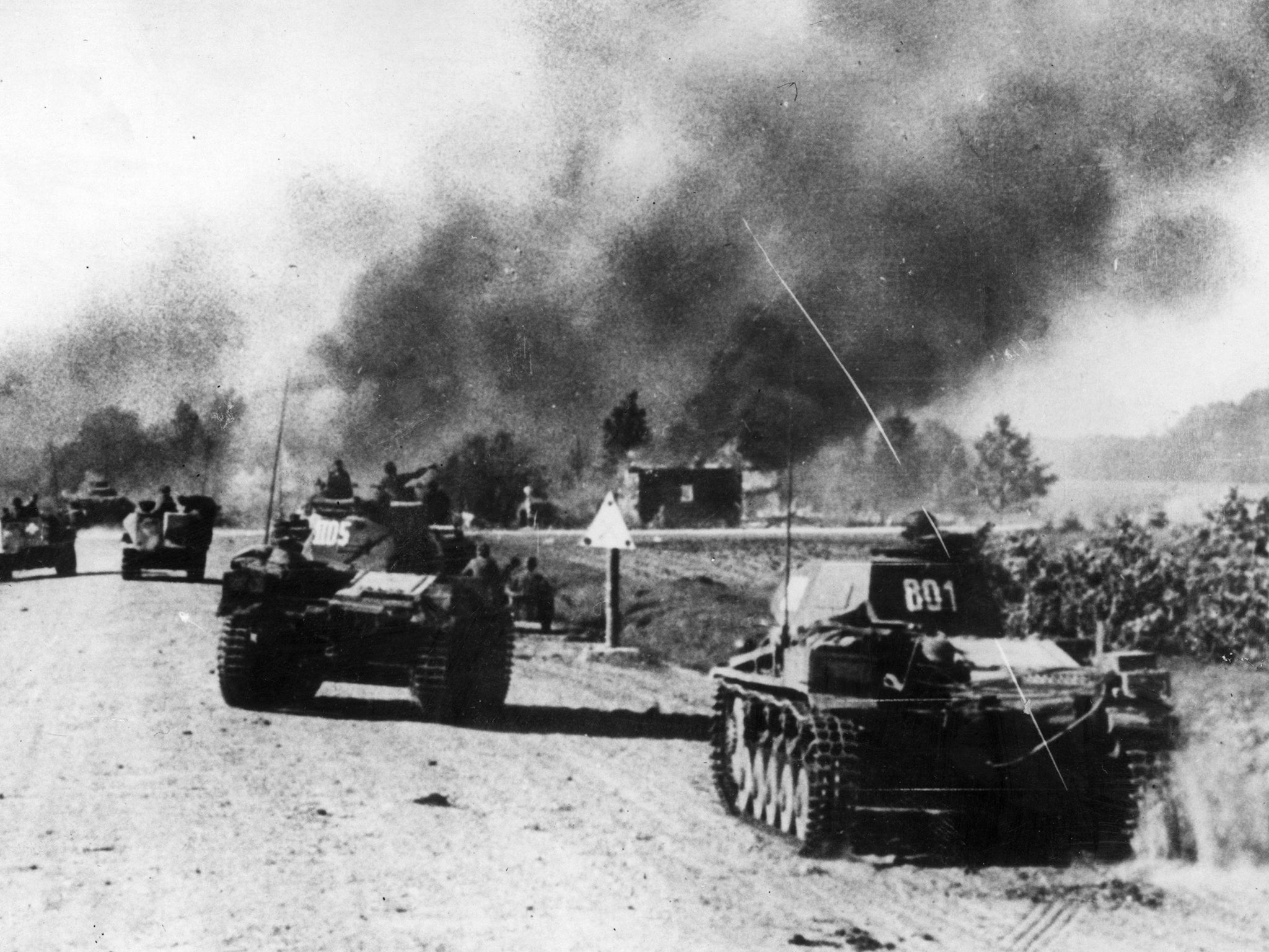 German panzer units pass through a Russian village in 1941, the year in which ‘Victims and Heroes’ is set (Getty)