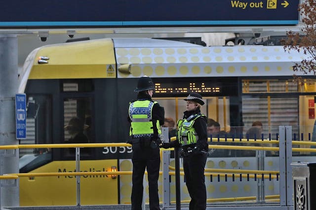 Officers tackled the armed attacker at the busy Metrolink station to ensure he was immediately detained
Officers at the Manchester Victoria Metrolink station, where three people were stabbed on New Year’s Eve