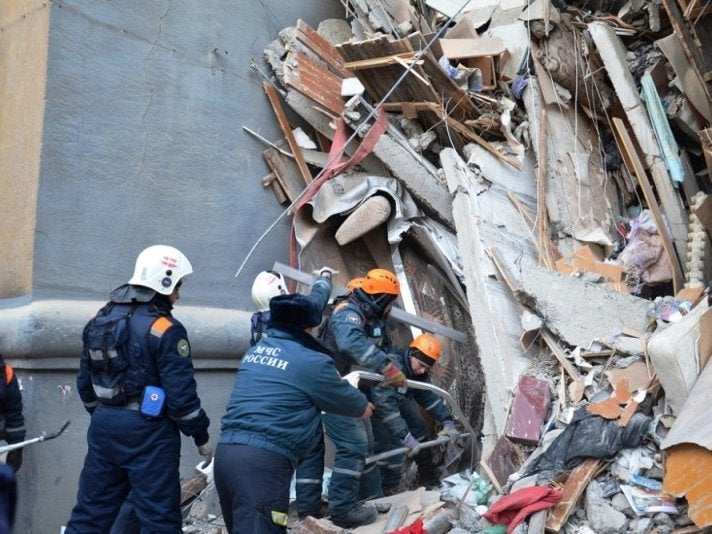 Rescuers work at the site of a partially collapsed apartment block in Magnitogorsk