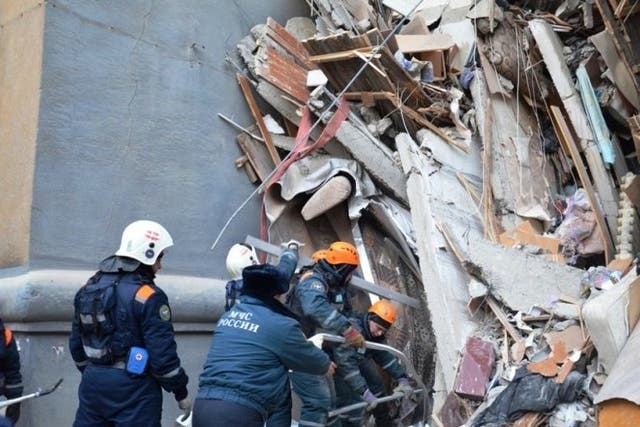 Rescuers work at the site of a partially collapsed apartment block in Magnitogorsk