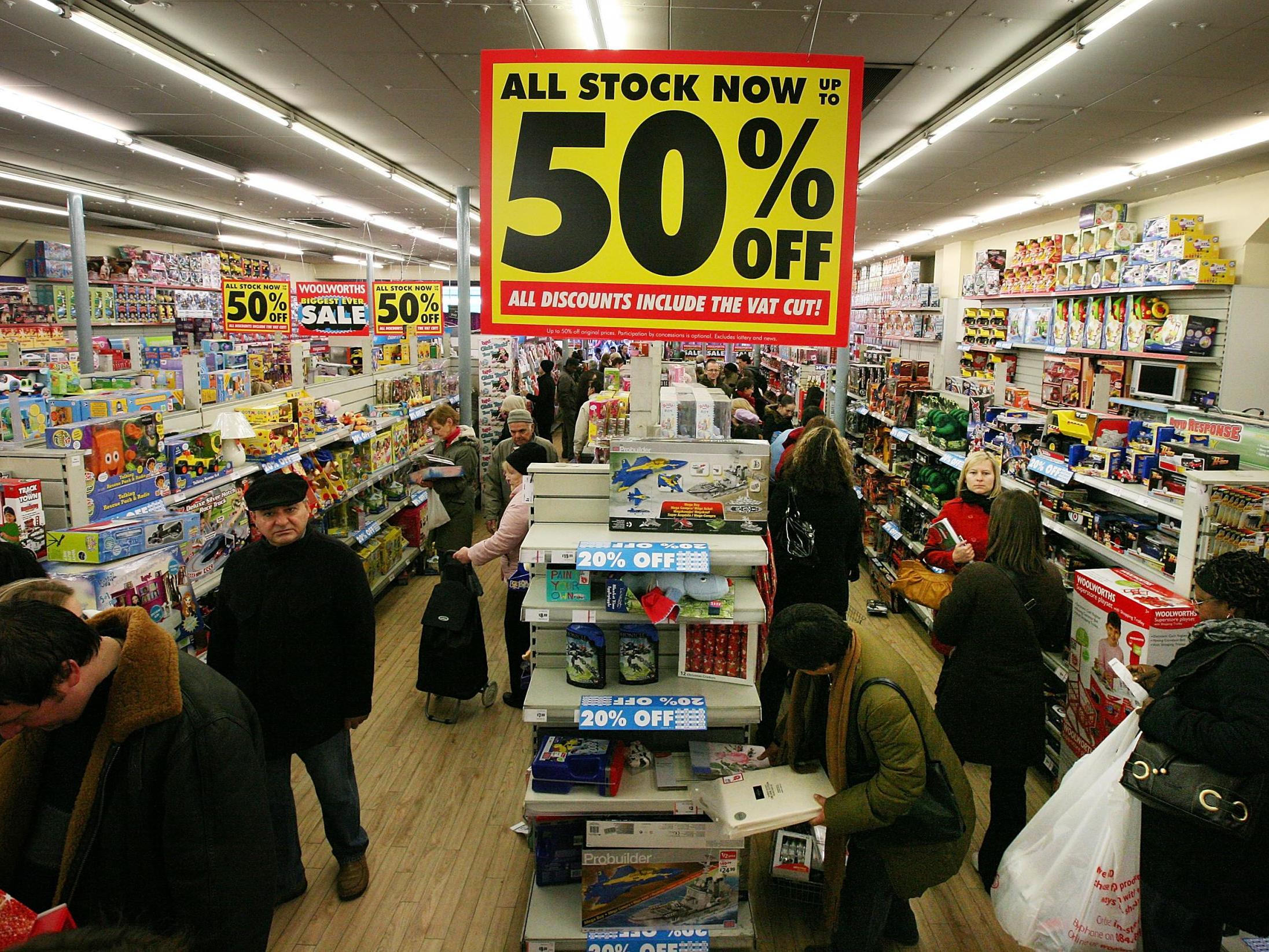 Customers shop in a branch of Woolworths in Camden on 5 December 2008