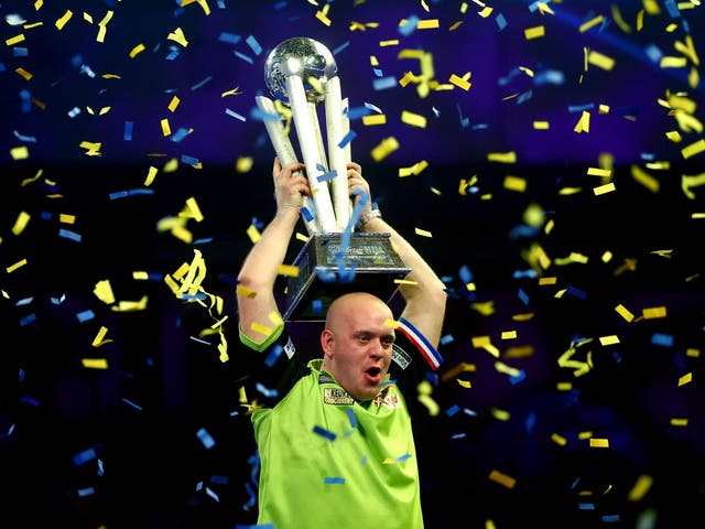 Michael van Gerwen of the Netherlands lifts his trophy after beating Michael Smith to win the 2019 William Hill World Darts Championship at Alexandra Palace on 1 January 2019