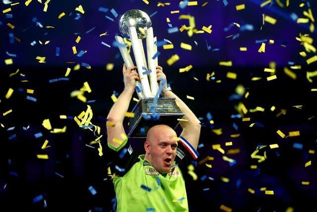 Michael van Gerwen of the Netherlands lifts his trophy after beating Michael Smith to win the 2019 William Hill World Darts Championship at Alexandra Palace on 1 January 2019