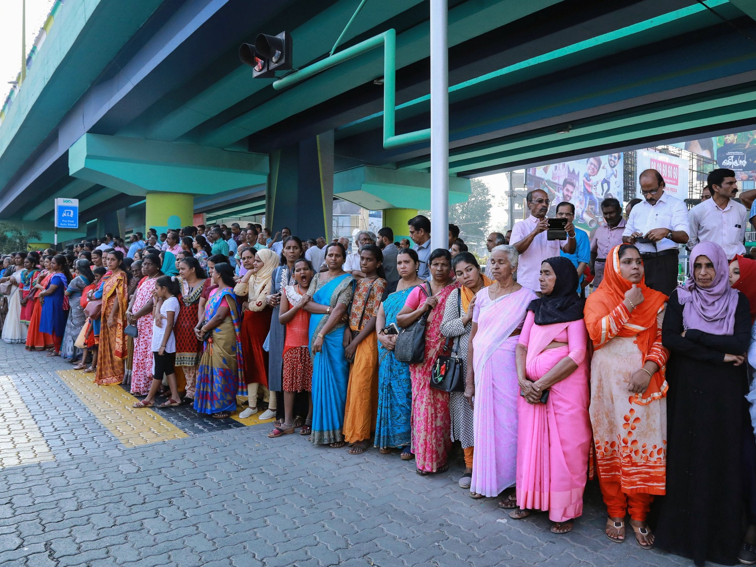 Indian women stand in a line to take part in the ‘women’s wall’ protest in Kochi in southern Kerala state