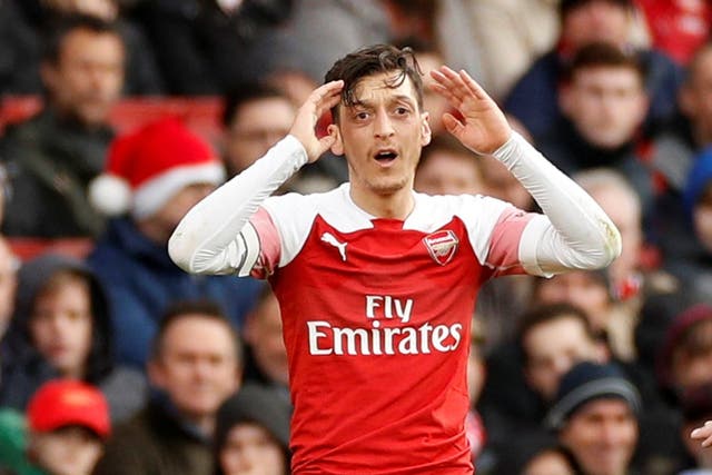 Mesut Ozil's agent insists the midfielder is happy at Arsenal for the foreseeable future