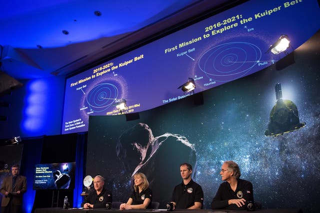 A handout photo made available by NASA shows New Horizons principal investigator Alan Stern (4-R), New Horizons project manager Helene Winters (3-R), Fred Pelletier (2-R), lead of the project navigation team and New Horizons co-investigator John Spencer (R) attending a press conference prior to the flyby of Ultima Thule by the New Horizons spacecraft, in Laurel, Maryland