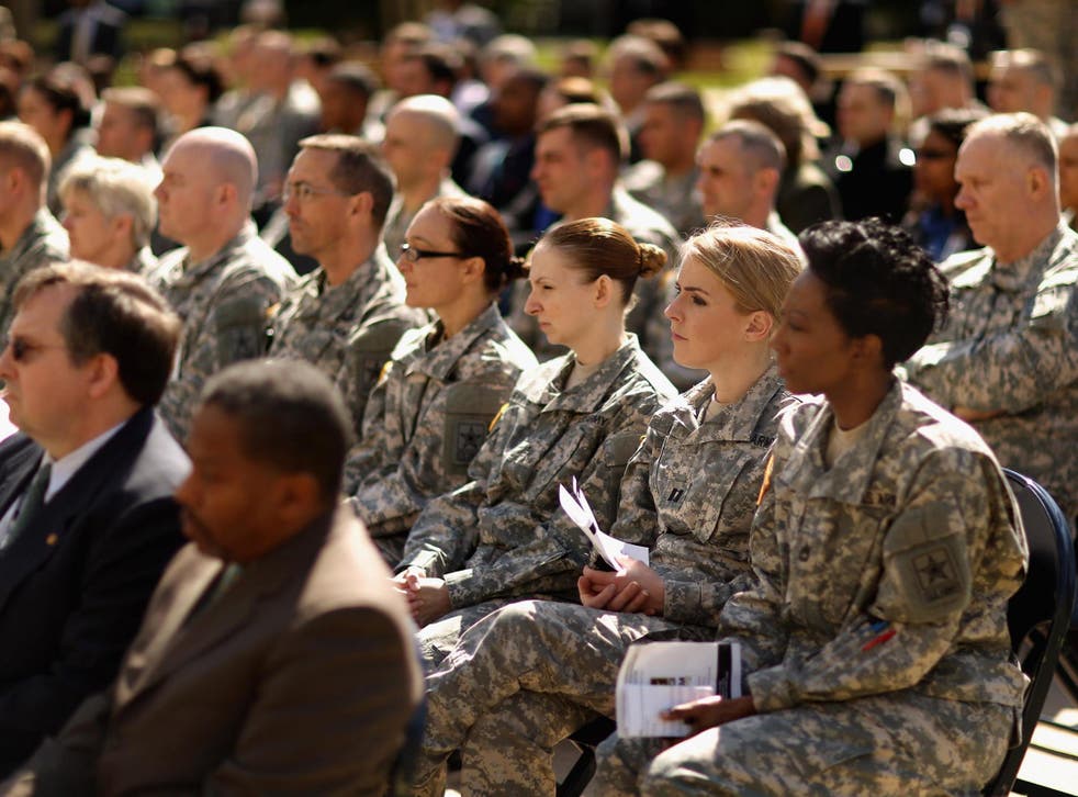 Soldiers, officers and civilian employees attend the commencement ceremony for the US Army's annual observance of Sexual Assault Awareness and Prevention Month in the Pentagon Center Courtyard in 2015 in Arlington, Virginia