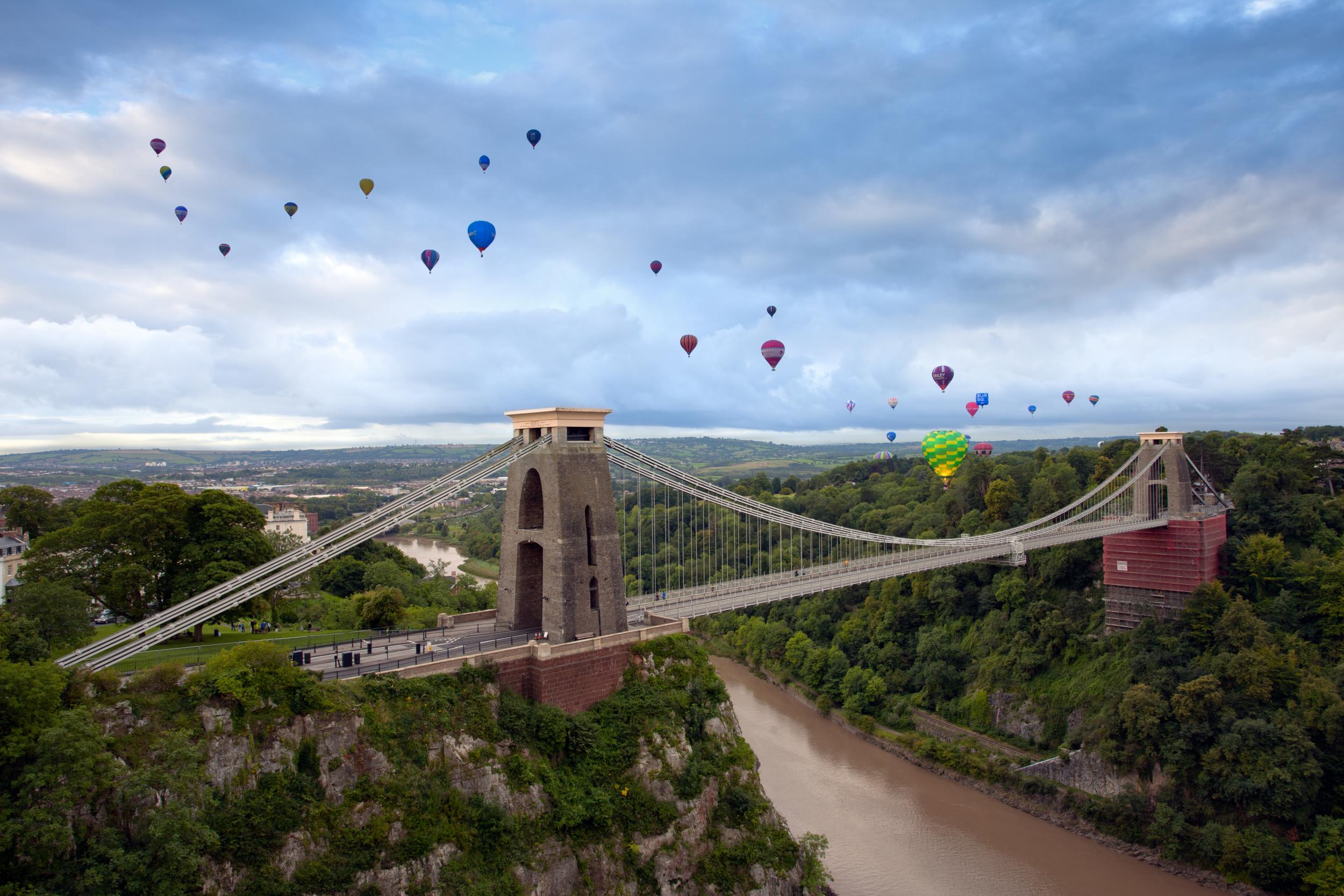 Hot air balloons drift across the Clifton Bridge