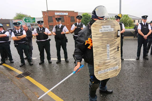 Police stand by during the Orangmen's march in Belfast in 2014; PSNI has asked up to 1,000 officers to be deployed in Northern Ireland as a reinforcement in case of a no-deal Brexit