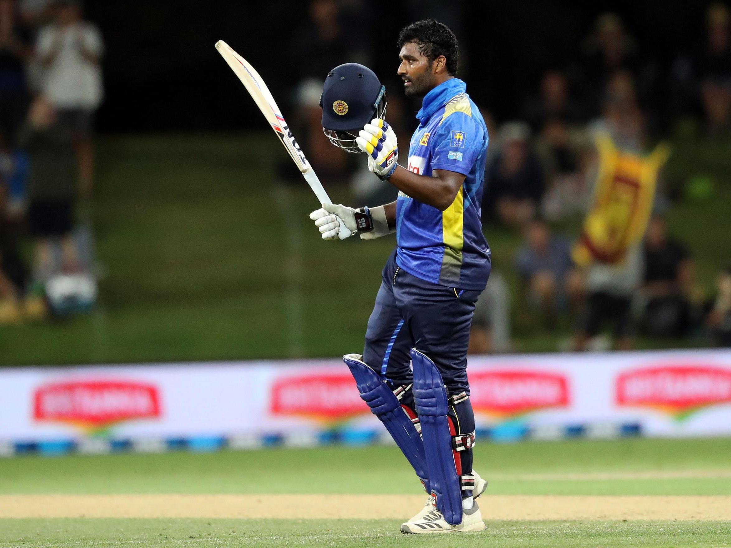 Thisara Perera celebrates hitting a century