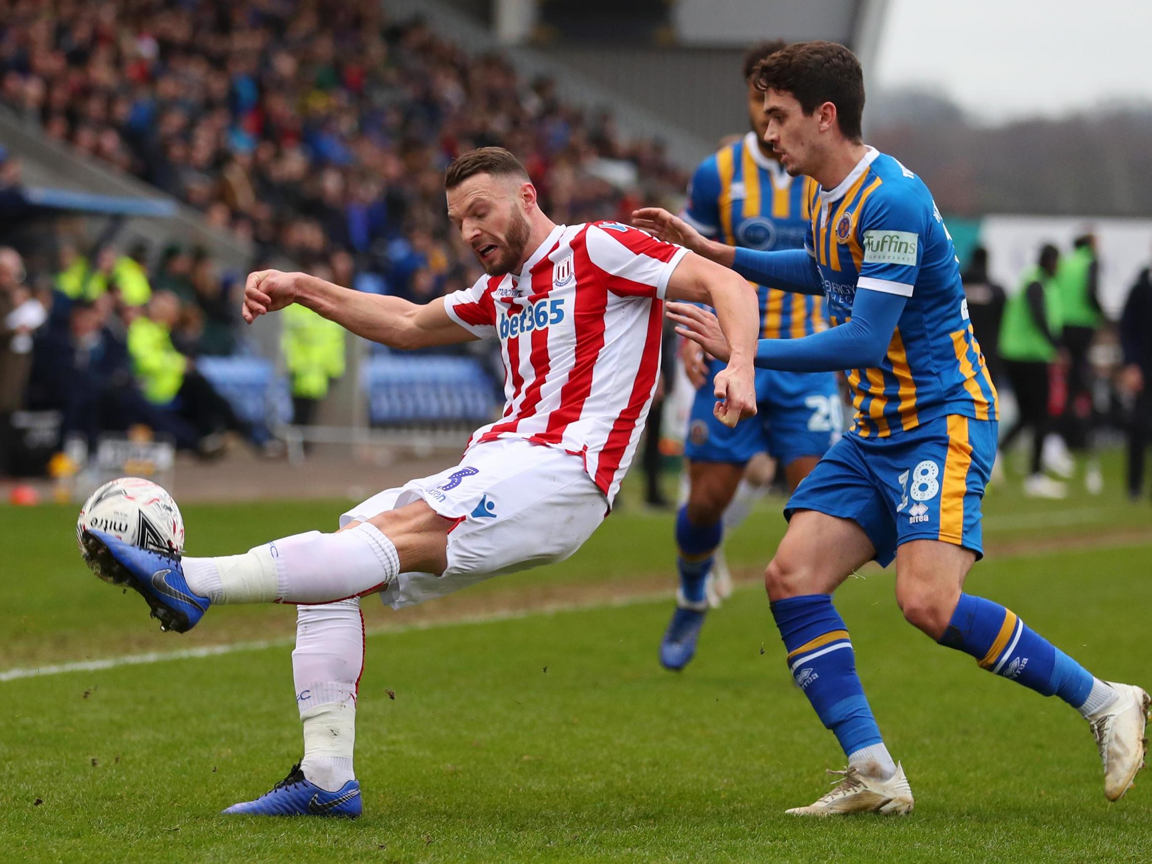 Erik Pieters clears the ball under pressure from Alex Gilliead