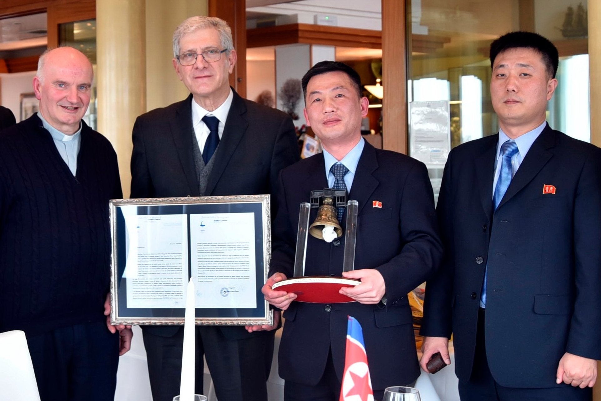 North Korea's acting ambassador to Italy Jo Song Gil (second right) has not been seen since early November and is believed to have gone into hiding wife his wife