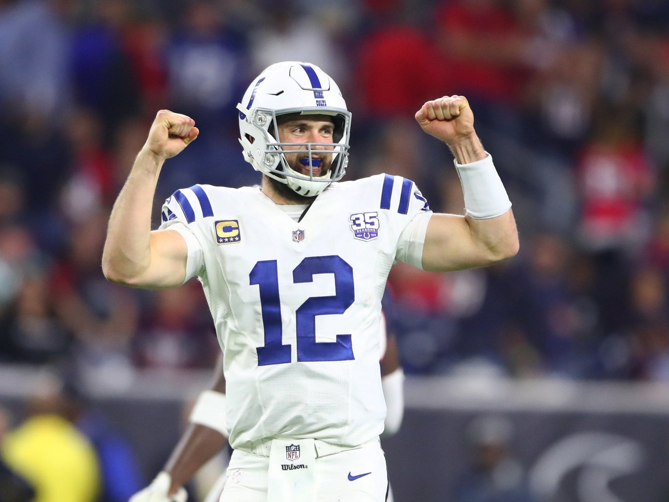 Andrew Luck celebrates in the closing seconds of the Colts' win over the Houston Texans