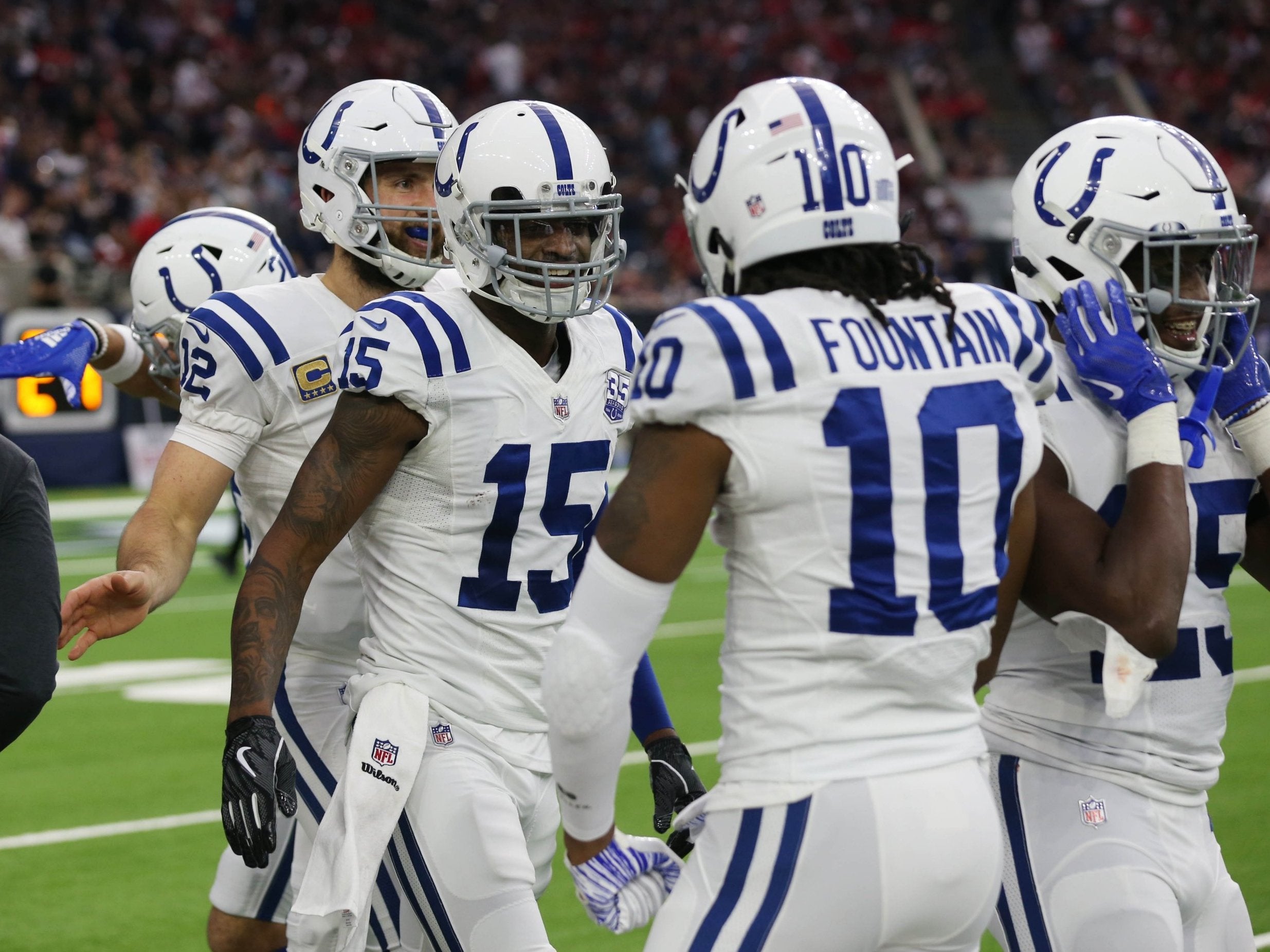 Dontrelle Inman (15) celebrates with teammates iafter a touchdown against the Houston Texans