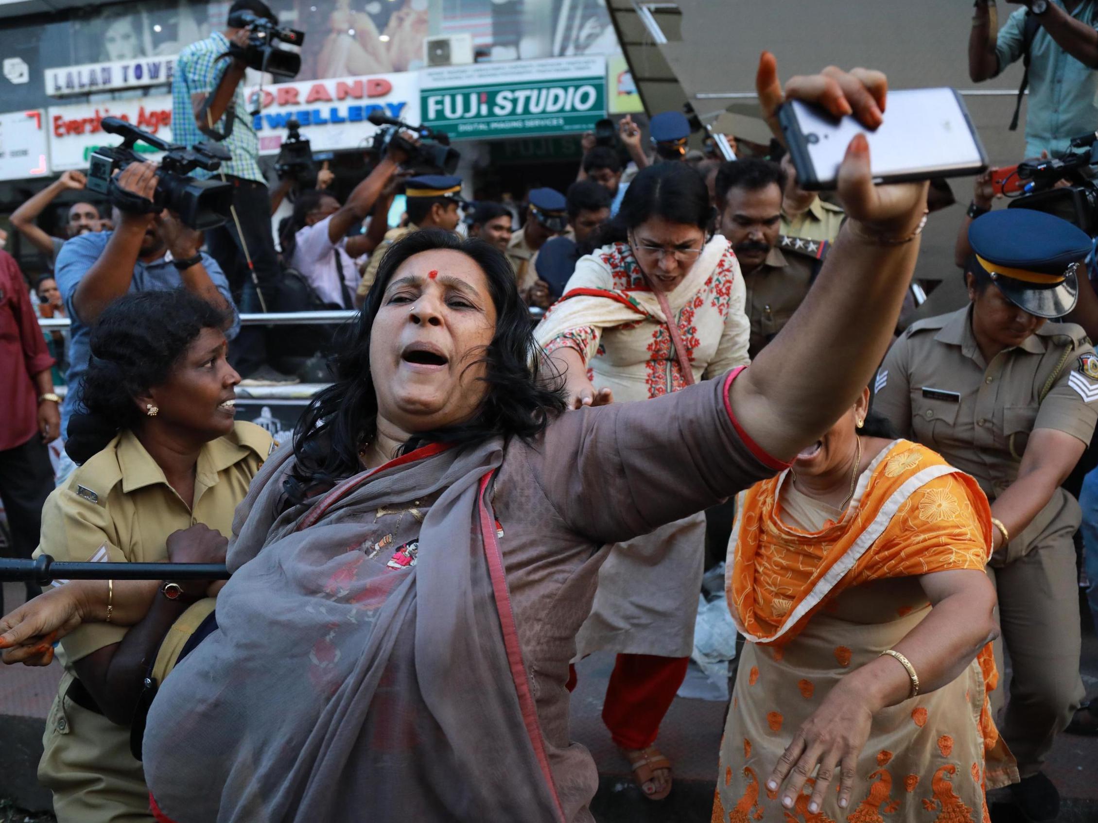 Indian police intervene as protesters try to disrupt a celebratory meeting