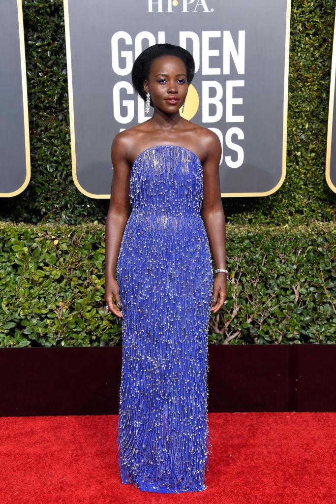 Black Panther actor Lupita Nyong’o opted for a purple beaded Calvin Klein dress