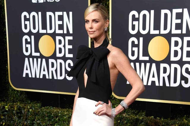 Charlize Theron wore a Time's Up x2 bracelet at the Golden Globes