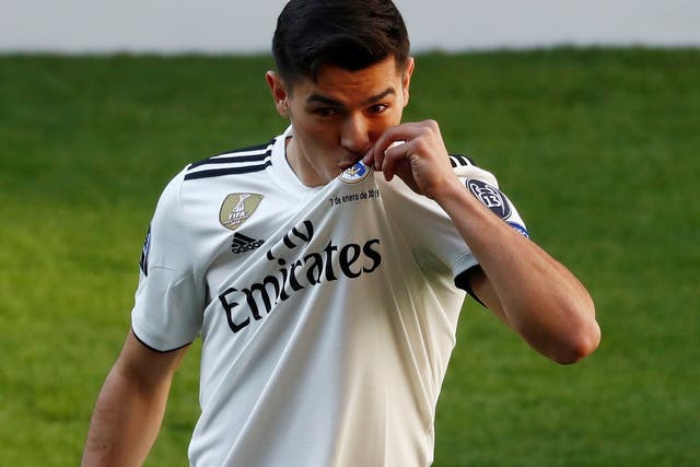 Real Madrid's Brahim Diaz poses on the pitch during the presentation