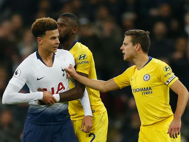 Tottenham Hotspur's Dele Alli is held back by Chelsea's Cesar Azpilicueta
