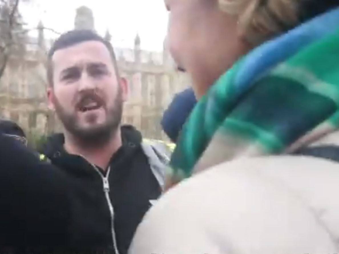 Protesters harass Anna Soubry, right, outside parliament on Monday