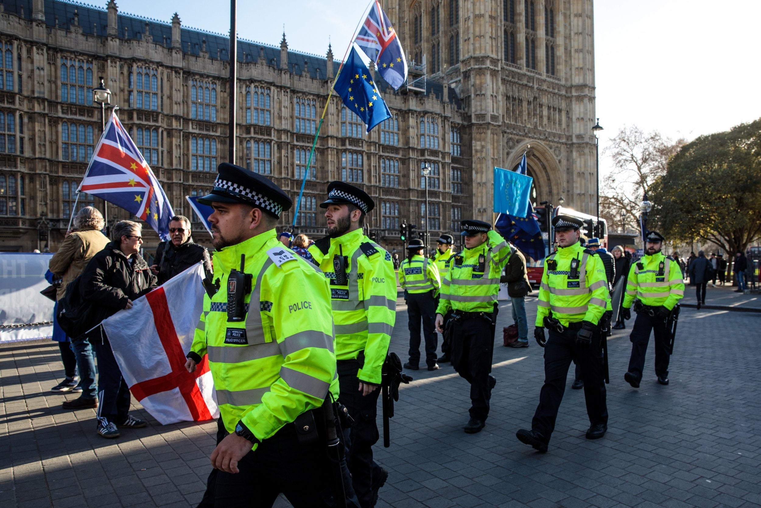 Police patrol as Brexit protesters demonstrate outside the Houses of Parliament