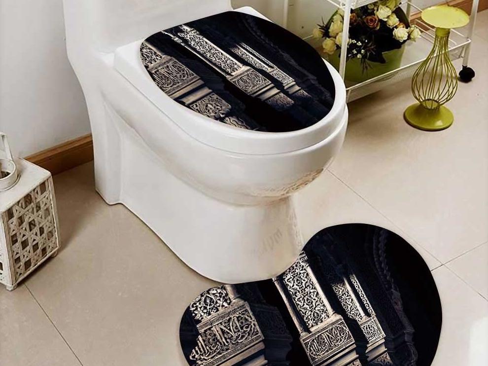 A toilet seat cover and mat decorated with the word 'Allah'