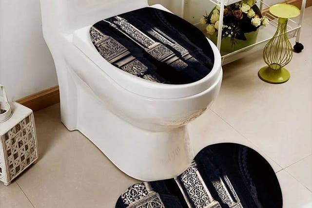 A toilet seat cover and mat decorated with the word 'Allah'