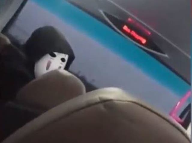 The masked man shocked his fellow passenger