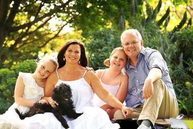 A doctored version of a portrait of Australian Prime Minister Scott Morrison and his family that was displayed on his website