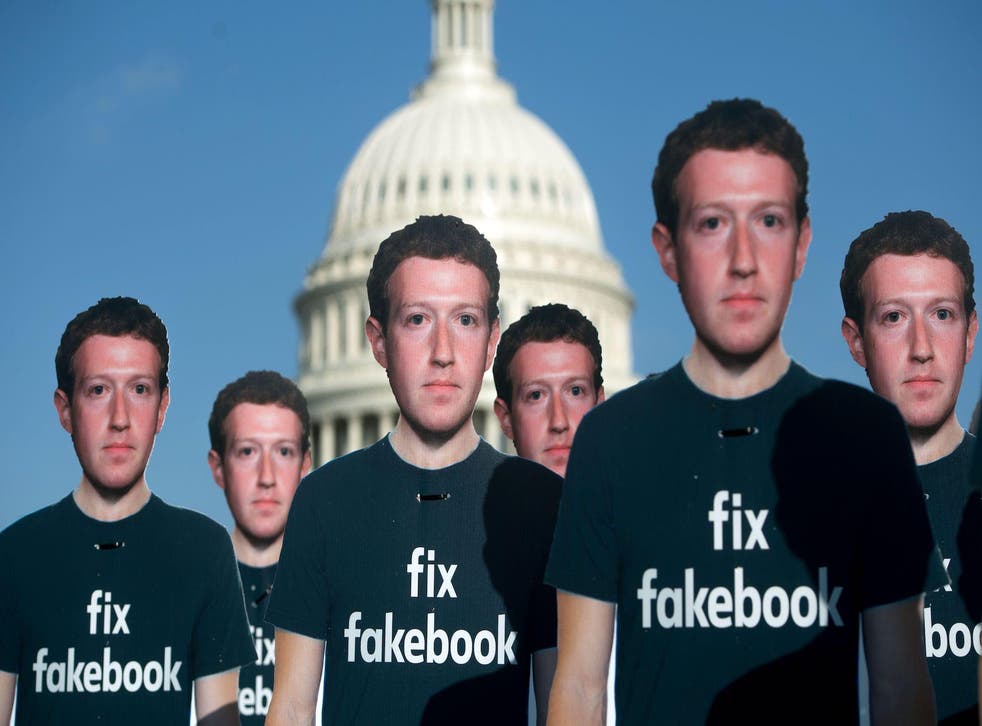 In this file photo taken on April 10, 2018, one hundred cardboard cutouts of Facebook founder and CEO Mark Zuckerberg stand outside the US Capitol in Washington, DC