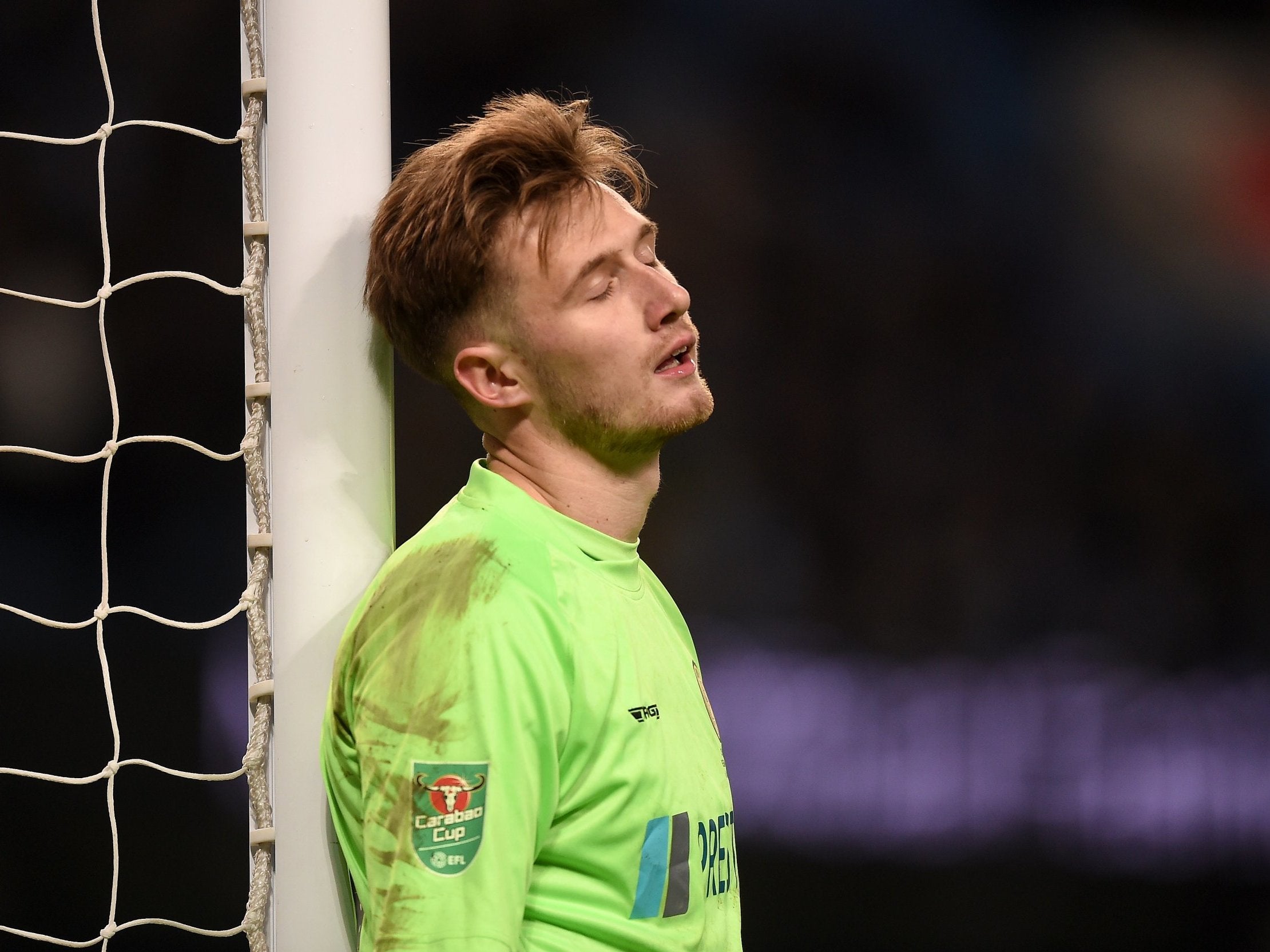 Goalkeeper Bradley Collins reacts after conceding a goal during Burton's heavy defeat