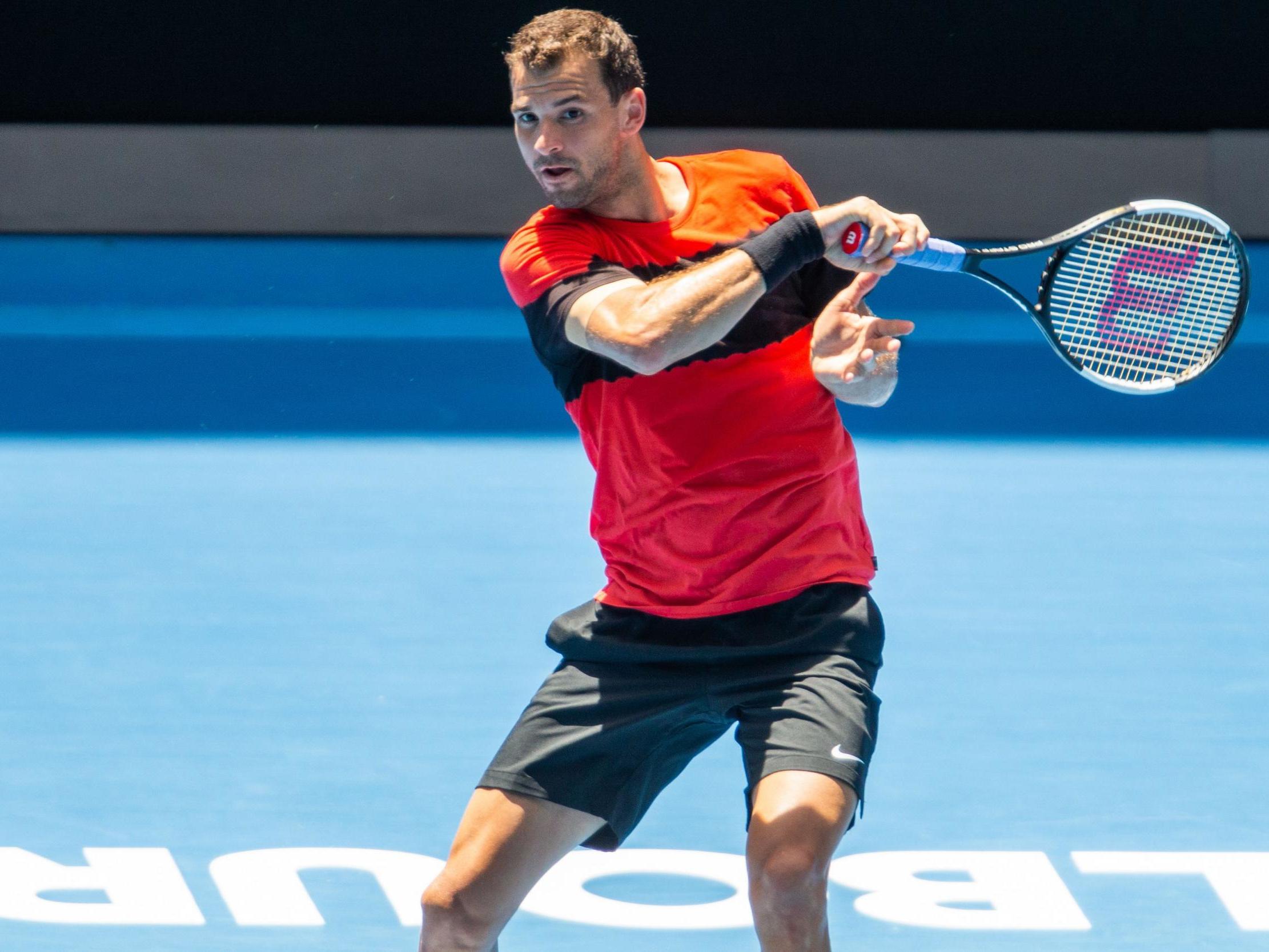 Dimitrov plays a forehand shot during a practice session in Melbourne