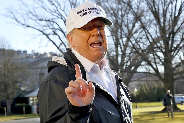 President Donald Trump gestures as a reporter asks a question, as he speaks to the media on the South Lawn of the White House, Thursday Jan. 10, 2019, in Washington, en route for a trip to the border in Texas as the government shutdown continues.