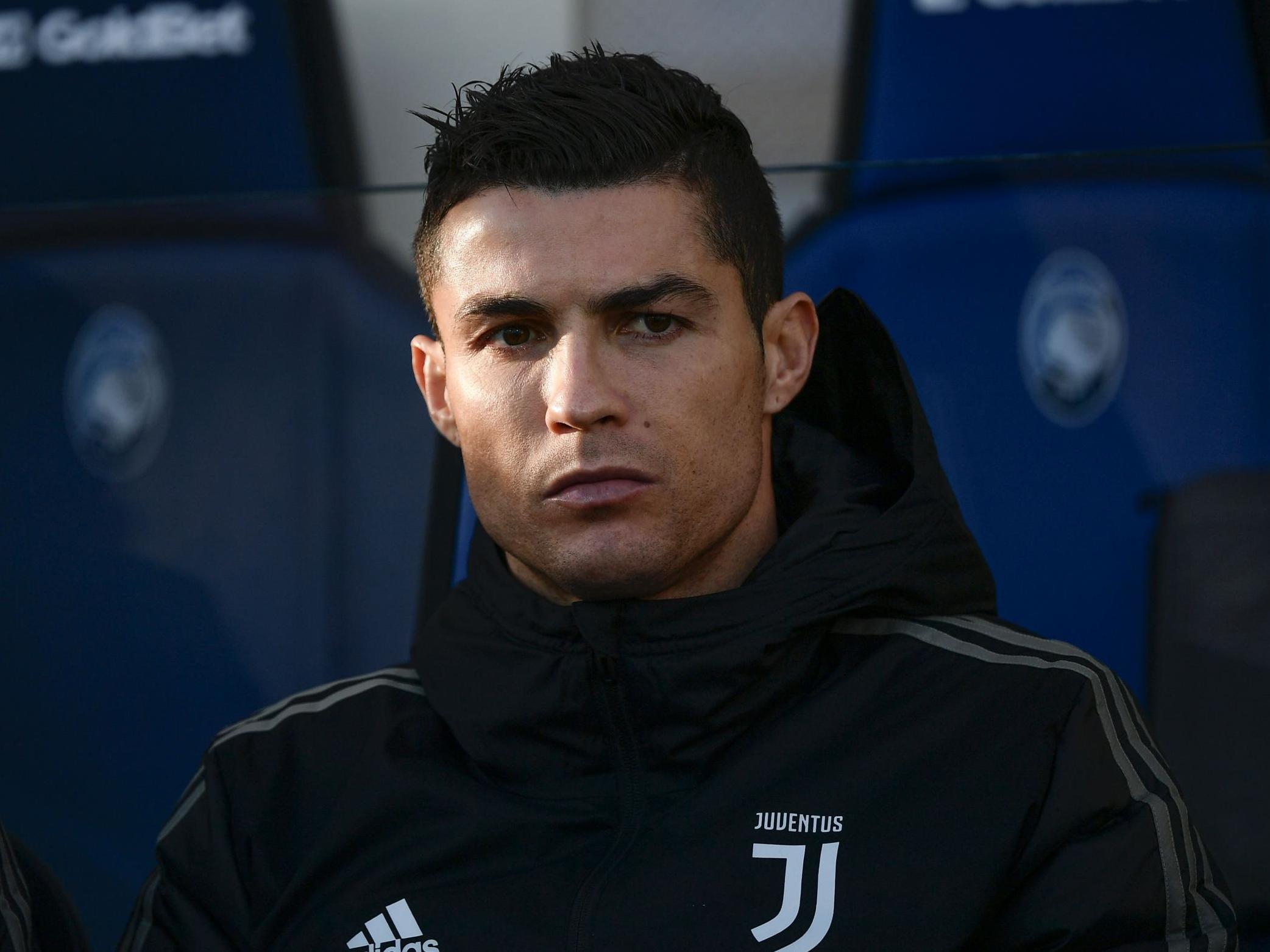 Juventus' Cristiano Ronaldo looks on from the substitutes' bench