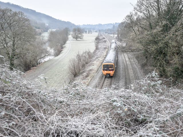 A train travels through rural Bath, as temperatures across parts of Britain dropped below freezing overnight