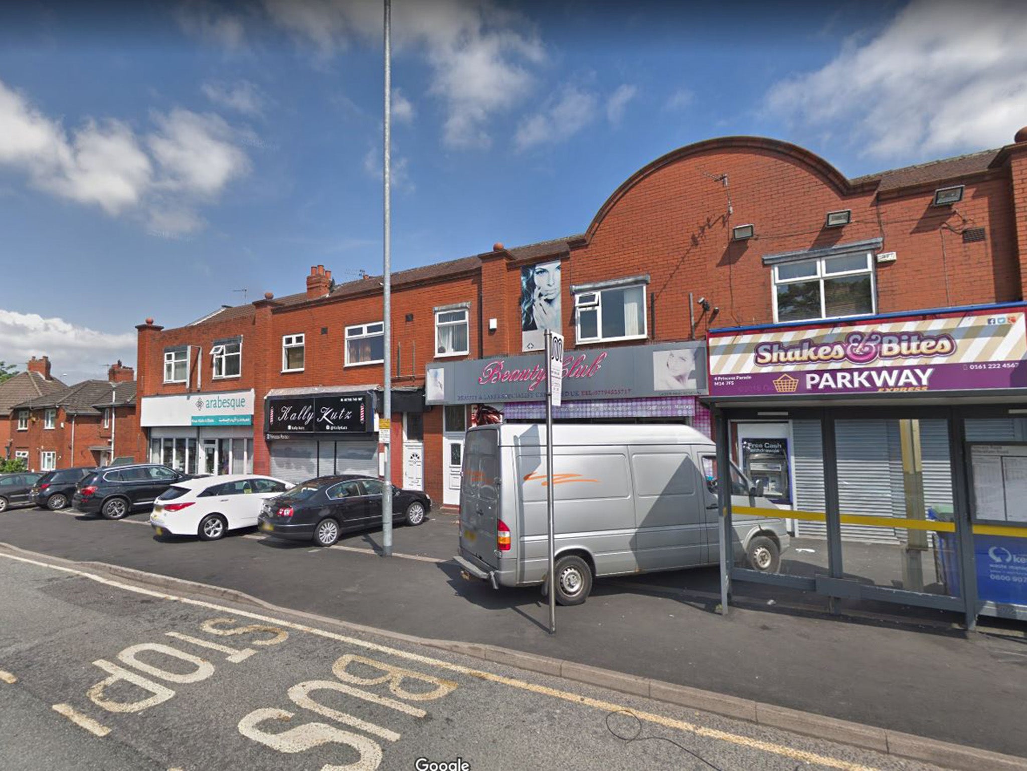 Armed robbers burst into the café on Princess Road in the Moss Side area of Manchester