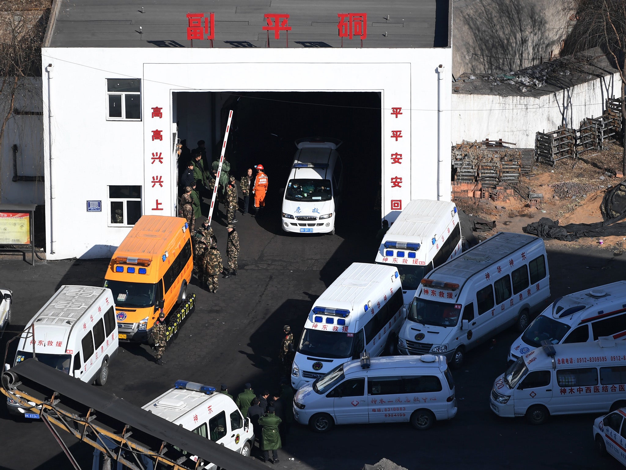 Rescuers at the mine near the city of Shenmu in Shaanxi province