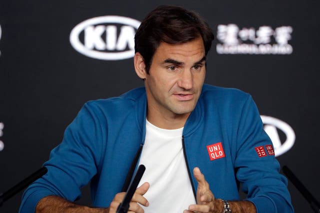 Switzerland's Roger Federer answers a question during a press conference