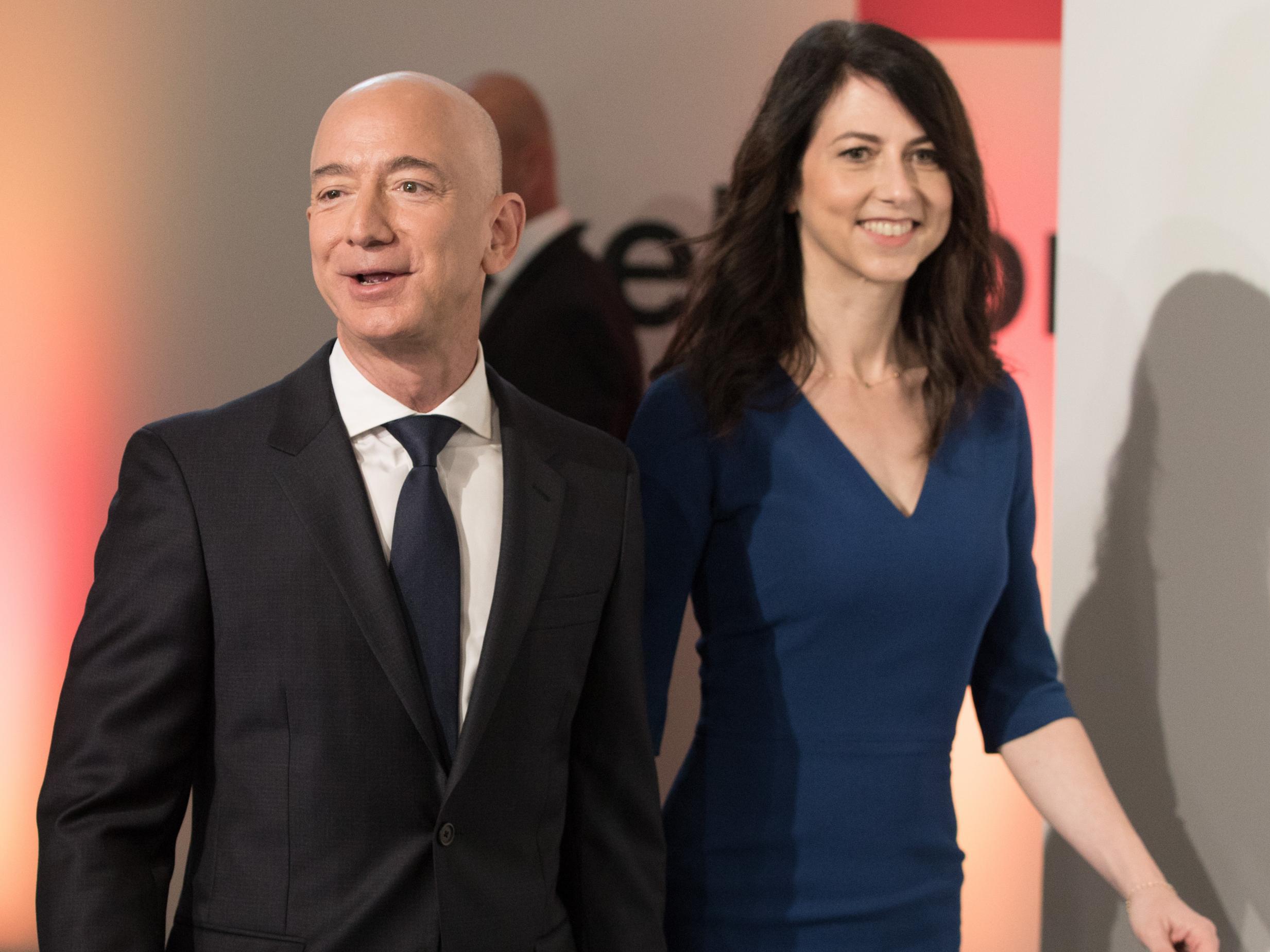 Bezos and wife MacKenzie at publisher Axel-Springer’s HQ in Berlin last April (Getty)