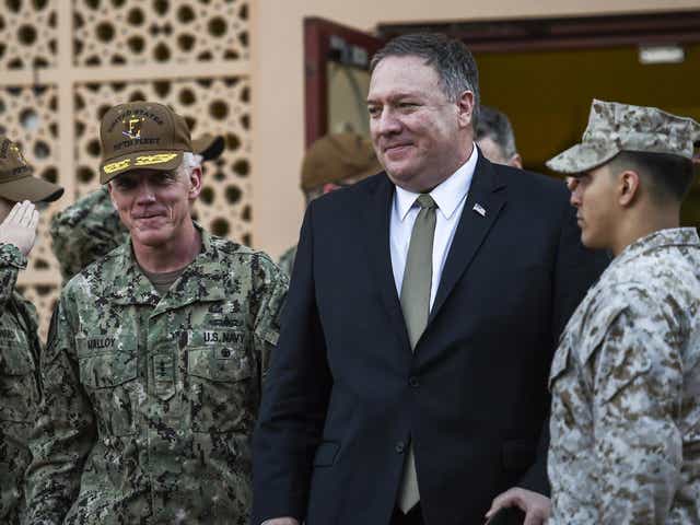 US Secretary of State Mike Pompeo, centre, walks with Vice Admiral James Malloy, commander of the US Naval Forces Central Command/5th Fleet, after a tour of the US Naval Forces Central Command center in Manama, Bahrain, Friday 11 January 2019